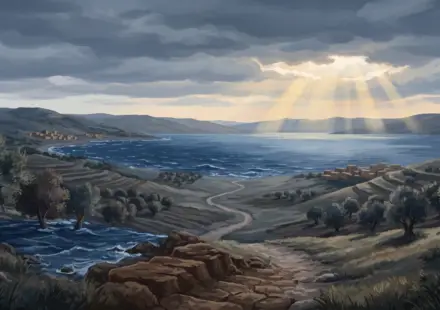 The Sea of Galilee under unsettled skies, with moving water in the foreground and calmer light breaking in the distance.